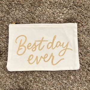 White Pouch with Gold Text